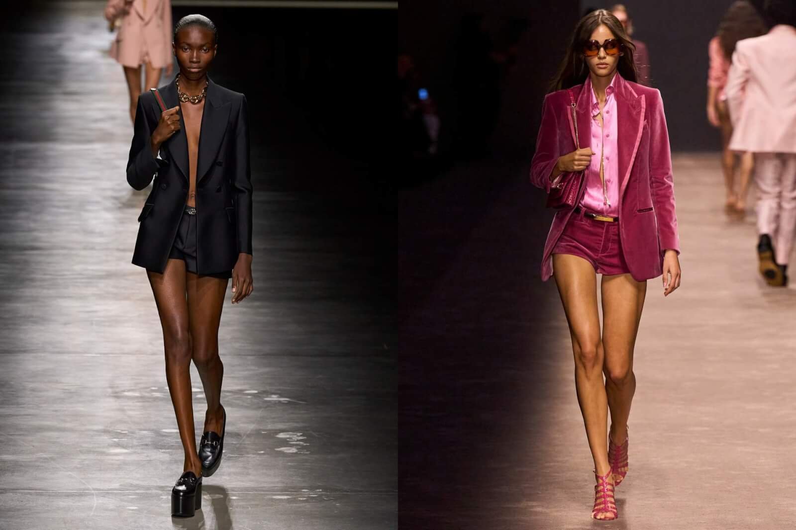 Two models walking on runway in blazers in shorts.