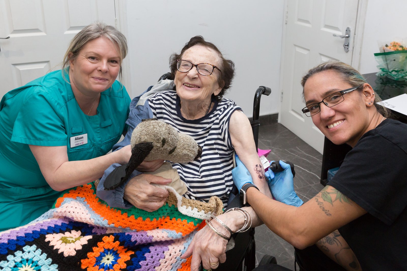 Care home resident getting her first tattoo