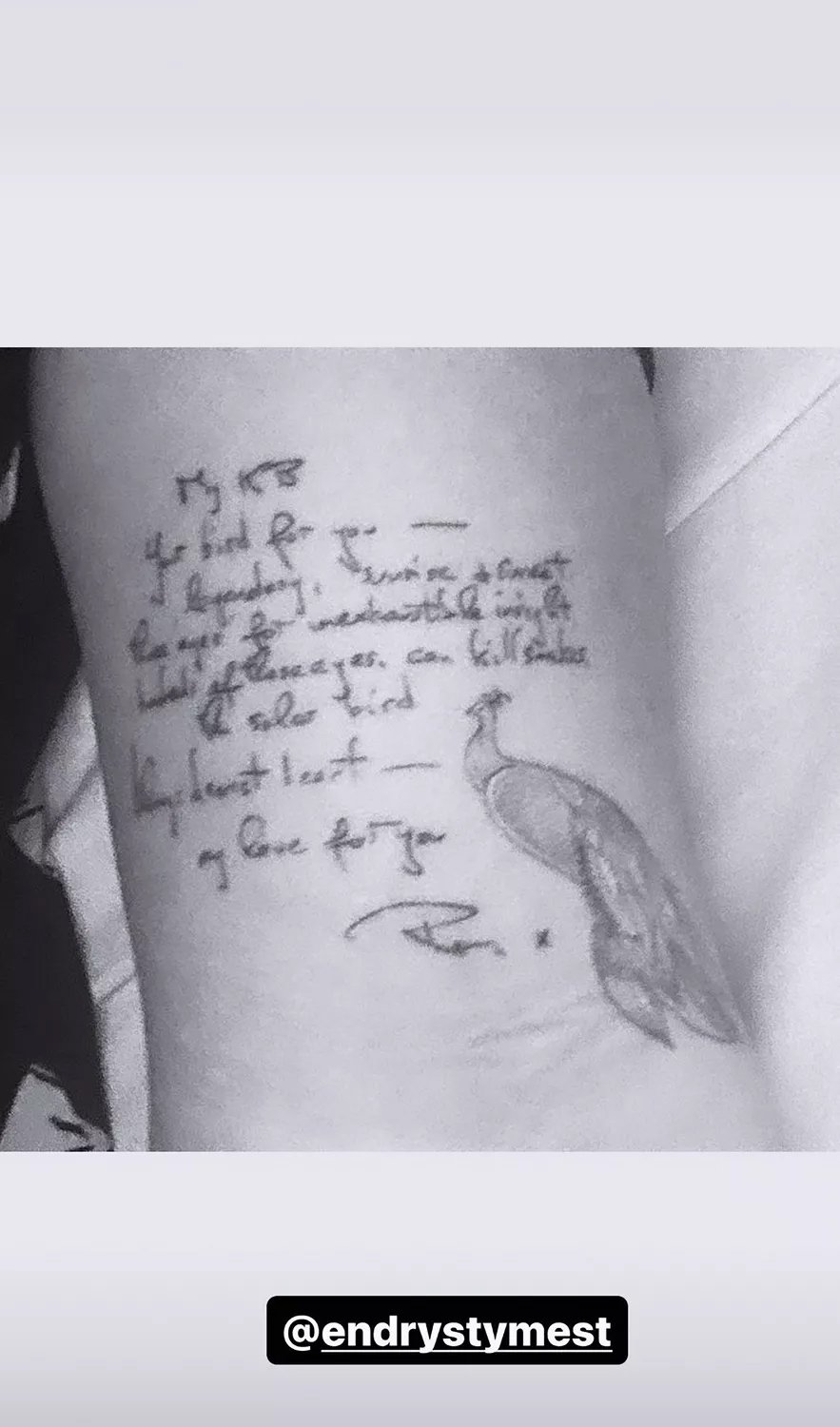 Kate Beckinsale tattoo. Handwritten message from father with bird next to it.