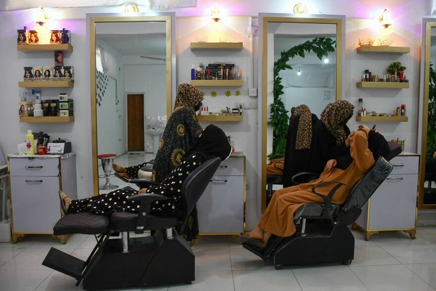 Afghan beauticians at work. Rina Amiri, the U.S. special envoy to Afghanistan, tweeted: "The Taliban ban on beauty parlors removes another vital space for women's work at a time when they're struggling to feed their families."