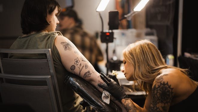 Rochester Expo Buzzes with Hundreds of Tattoo Irons as Guests Get Inked