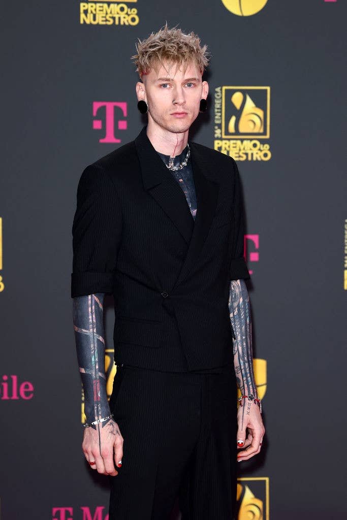 Watch MGK Reveal Behind-The-Scenes Footage of Creepy Blackout Tattoo